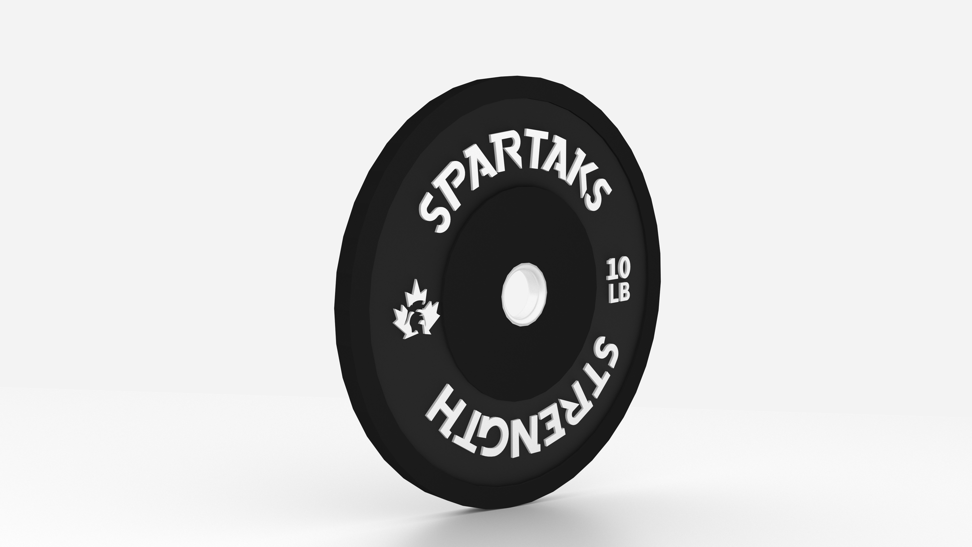 Black weight plate with 'Spartaks Strength' branding on a white background