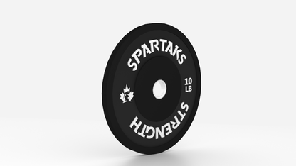 Black weight plate with 'Spartaks Strength' branding on a white background
