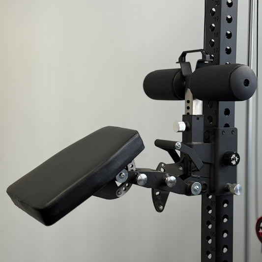 Black weightlifting bench attachment on a gray wall
