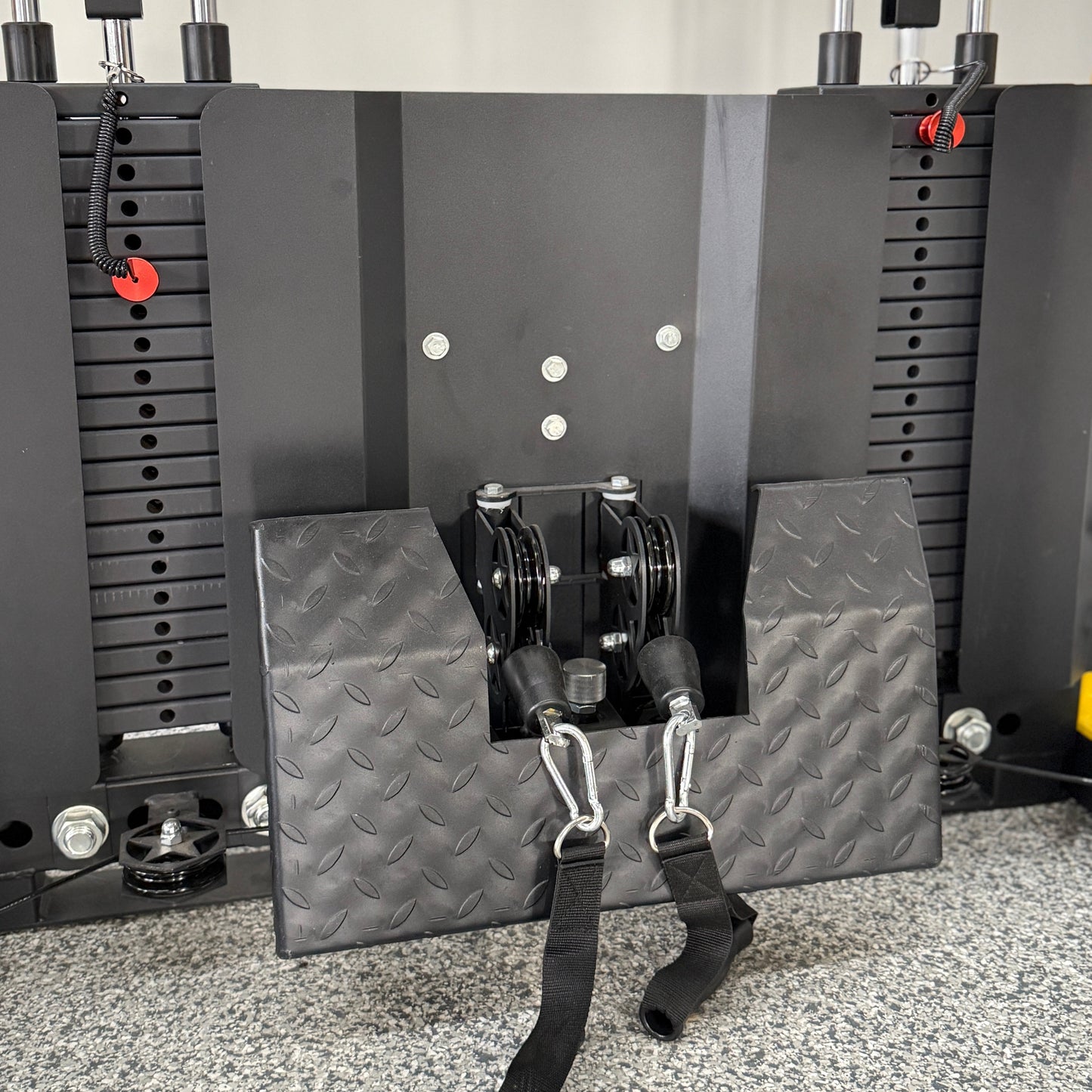 Textured metal footplate for functional trainer attached to a double weight stack and dual pulleys