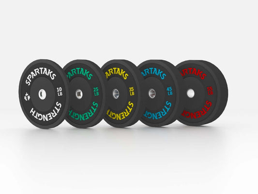 Spartaks Strength High Performance Bumper Plates (10LB to 55LB) showcasing different weight options in high-quality rubber.